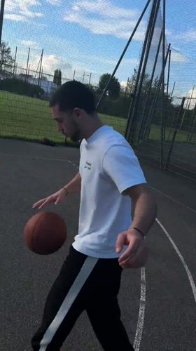 Young men play casual basketball in Strasbourg park