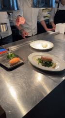 Moscow restaurant chefs prepare dishes in kitchen