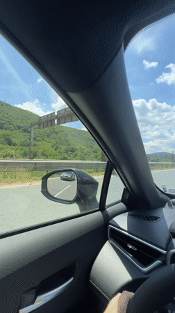 Highway drive through rural Bulgaria, dashboard nav in view