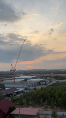 Sunset view captured over red-roofed structures in Pattaya City