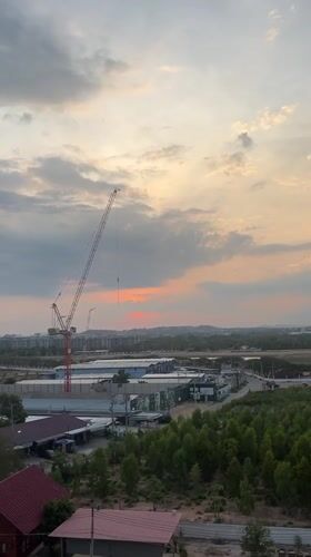 Sunset view captured over red-roofed structures in Pattaya City