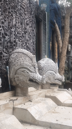 Temple carvings and decorated pool documented in Pattaya