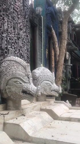 Temple carvings and decorated pool documented in Pattaya