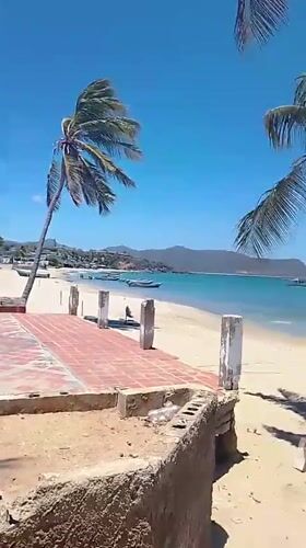 Sunny afternoon beach scene documented in Juan Griego, Venezuela