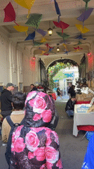 Budapest market arcade bustling with vendors and pedestrians