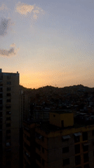 Twilight view captures dense Caracas cityscape from elevated position