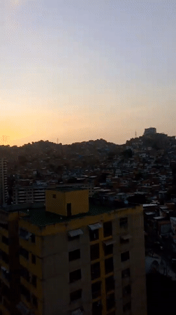 Twilight view captures dense Caracas cityscape from elevated position