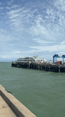 Ferry arrival and passenger disembarkation at Don Sak pier