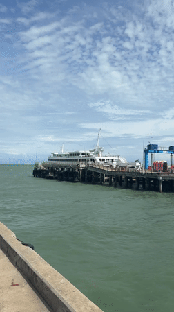 Ferry arrival and passenger disembarkation at Don Sak pier
