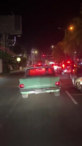 Vintage green Honda spotted driving through Denpasar streets
