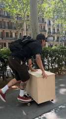 Man skateboards through sunny Barcelona streets