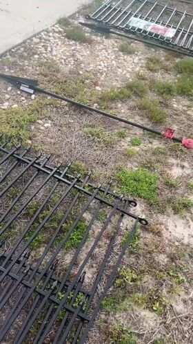 Fence panels await assembly on Cape Coral lawn