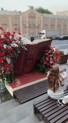 Two girls converse on Moscow bench