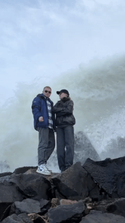 Couple poses for photos at waterfall in Chernushka, Russia