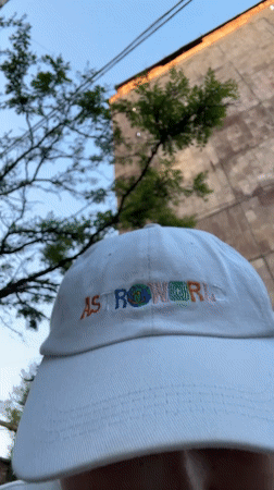 Person documents burning ASTROWORLD cap, city scenes in Yerevan