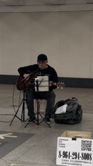 Street musician performs acoustic set in Moscow subway station