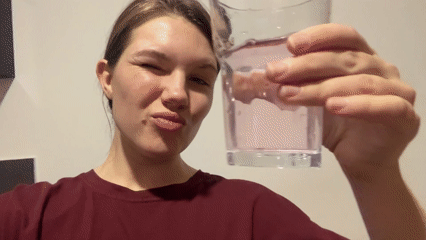 Woman drinks from glass, spills water in Belgrade suburb