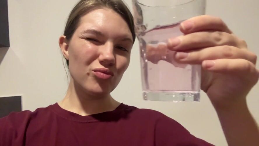 Woman drinks from glass, spills water in Belgrade suburb