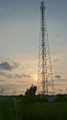 Rural telecommunications tower and rice fields observed near Lhokseumawe