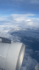 Passenger documents aerial flight views over Sochi mountains and coast