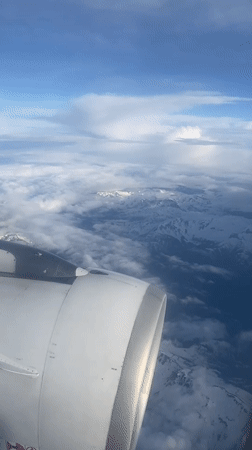 Passenger documents aerial flight views over Sochi mountains and coast