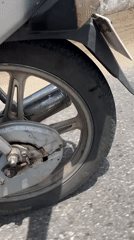 Motorcycle travels along asphalt road in Badagry, Nigeria