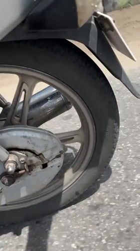Motorcycle travels along asphalt road in Badagry, Nigeria