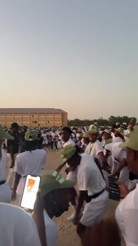 Young adults gather in formation on field in Maiduguri
