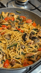 Home pasta dinner prepared in Catania with chicken and vegetables
