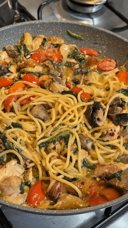 Home pasta dinner prepared in Catania with chicken and vegetables