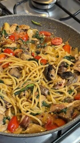 Home pasta dinner prepared in Catania with chicken and vegetables