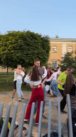 European city at dusk: streets, rooftops, and evening activity