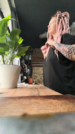 Woman with pink hair documented in morning routine, Noviy Russia