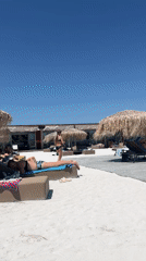 Poolside and beach scene on a sunny summer day in Kazichene