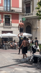 Street performers draw crowds in Barcelona public square