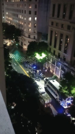 Police vehicles, officers line Buenos Aires street at night