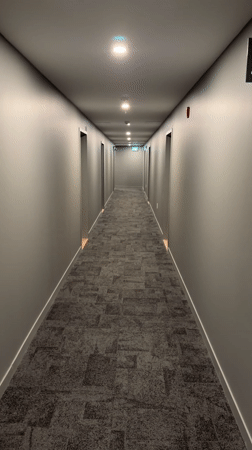 Small dog spotted running through hallway in Laval