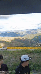 Paraglider spotted over Caracas mountains during evening hours