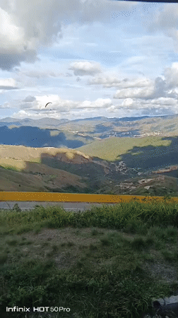 Paraglider spotted over Caracas mountains during evening hours