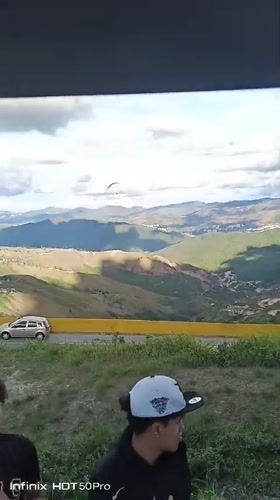 Paraglider spotted over Caracas mountains during evening hours