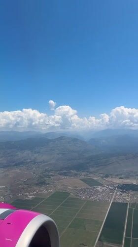 Passenger documents Montenegro landscape during morning flight over Krupice region