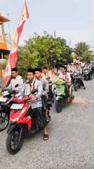 Religious procession and marching band fill Cilegon streets