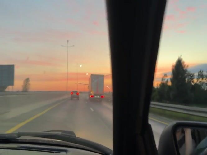 Evening drive near Perm under a vivid summer sunset