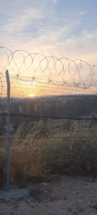 Dawn observed through security barriers in southern Israel