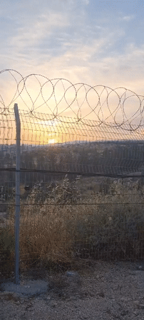Dawn observed through security barriers in southern Israel