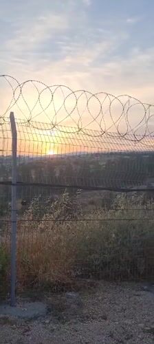 Dawn observed through security barriers in southern Israel