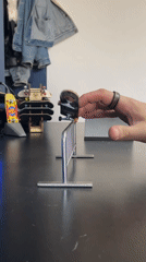 Fingerboard enthusiast performs tricks on table in Yekaterinburg