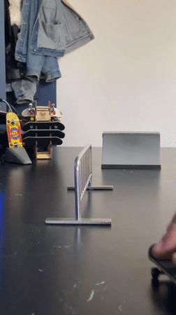 Fingerboard enthusiast performs tricks on table in Yekaterinburg