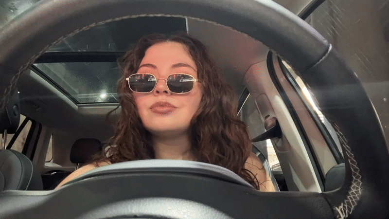 Woman observed adjusting appearance in car driver's seat, Puebla