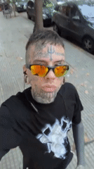 Tattooed baker observed preparing dough, walking Buenos Aires streets